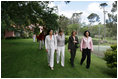 Mrs. Laura Bush walks with women leaders during her visit Friday, Nov. 4, 2005, to Estancia Santa Isabel, a ranch near Mar del Plata, site of the 2005 Summit of the Americas.