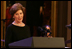 Mrs. Laura Bush welcomes guests to the East Room for entertainment Thursday night, Sept. 14, 2006, during the Thelonious Monk Institute of Jazz dinner at the White House. White House photo by Shealah Craighead 