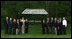 Mrs. Laura Bush poses with directors of the Presidential Libraries Wednesday, June 4, 2008, during their visit to Camp David in Thurmont, Maryland.