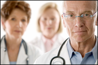 a photo of hospital staff at a desk