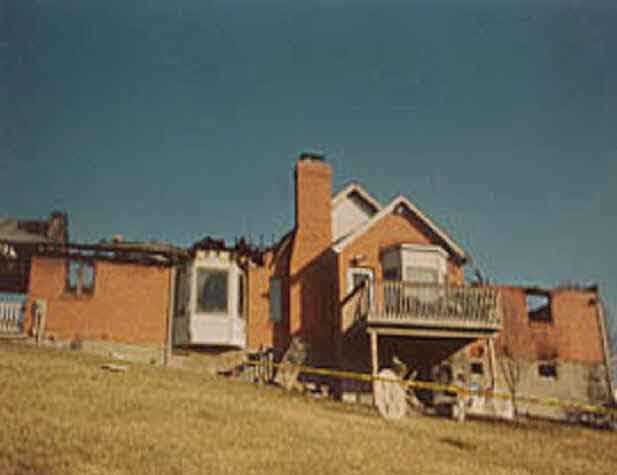 Rear french door under a deck where the victim was removed from the basement of the structure.