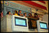 Mrs. Laura Bush is applauded as she stands over the New York Stock Exchange Monday, Sept. 18, 2006, where she visited to highlight literacy's role in extending the benefits of free enterprise to individuals around the world. White House photo by Shealah Craighead 