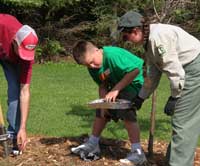 Lakewood-Laona's Nicole Shutt assisting students with planting.