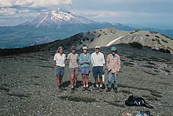 Shasta-Trinity National Forest botanists on the serpentine alpine summit of Mt. Eddy. Mt. Shasta is in the background