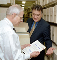 Ben Hull (left) and Jim Scala review a PB issue in the series' new home, one of four refurbished spaces on the fifth floor of the John Adams Building.