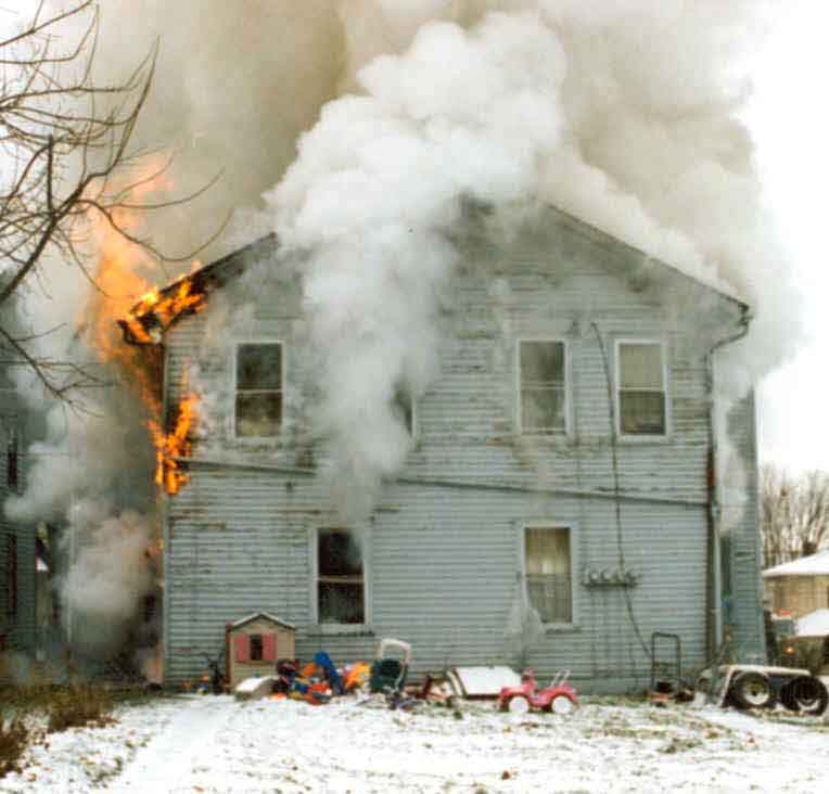 Front Page Photo: Photograph of the rear of the burning structure.