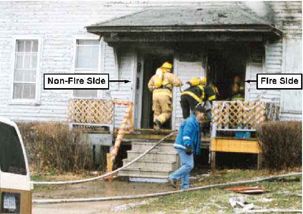 Photo 2.  Photograph of the front of the structure, depicting the non-fire side and the fire side of the structure.