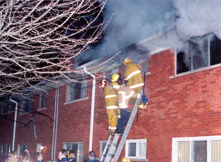Photo 3.  Photograph of Fire Fighter #1 being removed from the bathroom window.