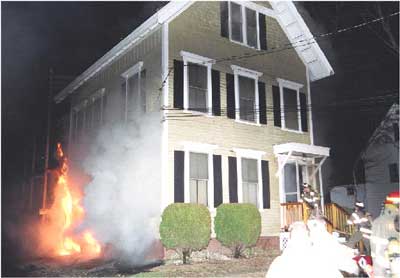 Photo 2. B-side basement windows engulfed in flames.