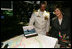 Mrs. Laura Bush and Captain John Litherland, Commanding Officer of the USS Texas, pause in the control room of the submarine during a tour of the ship Saturday, September 9, 2006, in Galveston, Texas. Mrs. Bush later participated in the Commissioning Ceremony marking the entry of the vessel into the U.S. Atlantic Fleet. White House photo by Shealah Craighead 