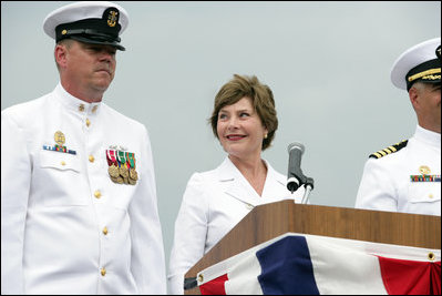 Mrs. Laura Bush smiles at Master Chief (SS) Mark K. Brooks, Command Master Chief, USS Texas, Saturday, September 9, 2006, after delivering remarks and giving the traditional command: "Man your ship and bring it to life!", during the Commissioning Ceremony in Galveston, Texas. Mrs. Bush participated in the christening of ship on July 31, 2004. White House photo by Shealah Craighead 