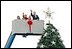  After placing a star on the National Christmas Tree, Lynne Cheney, wife of Vice President Dick Cheney, participates in the annual Pageant of Peace tree-topping tradition with Peter Nostrand, chairman of the Christmas Pageant of Peace program, right, and her three grandchildren (from left): Elizabeth Perry, 7, Grace Perry, 4, Kate Perry, 10, on the Ellipse near the White House Tuesday, Nov. 23, 2004. The 81st lighting of the famous tree takes place Dec. 2, 2004.