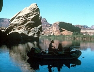 people fishing on lake