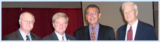 Appearing in Cambridge, Ohio, the Librarian of Congress (right) poses with (from left) Larry Caldwell, president of the board of directors of the Pritchard Laughlin Civic Center, Rep. Bob Ney, and Wayne Lawson, executive director of the Ohio Arts Council.