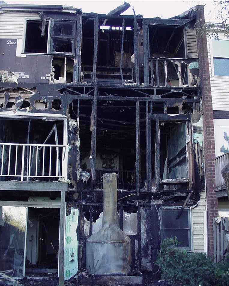 front page photo: Photograph of the burned-out townhouse involved in this incident.