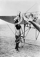 Harriet Quimby Turning Over Plane Propeller