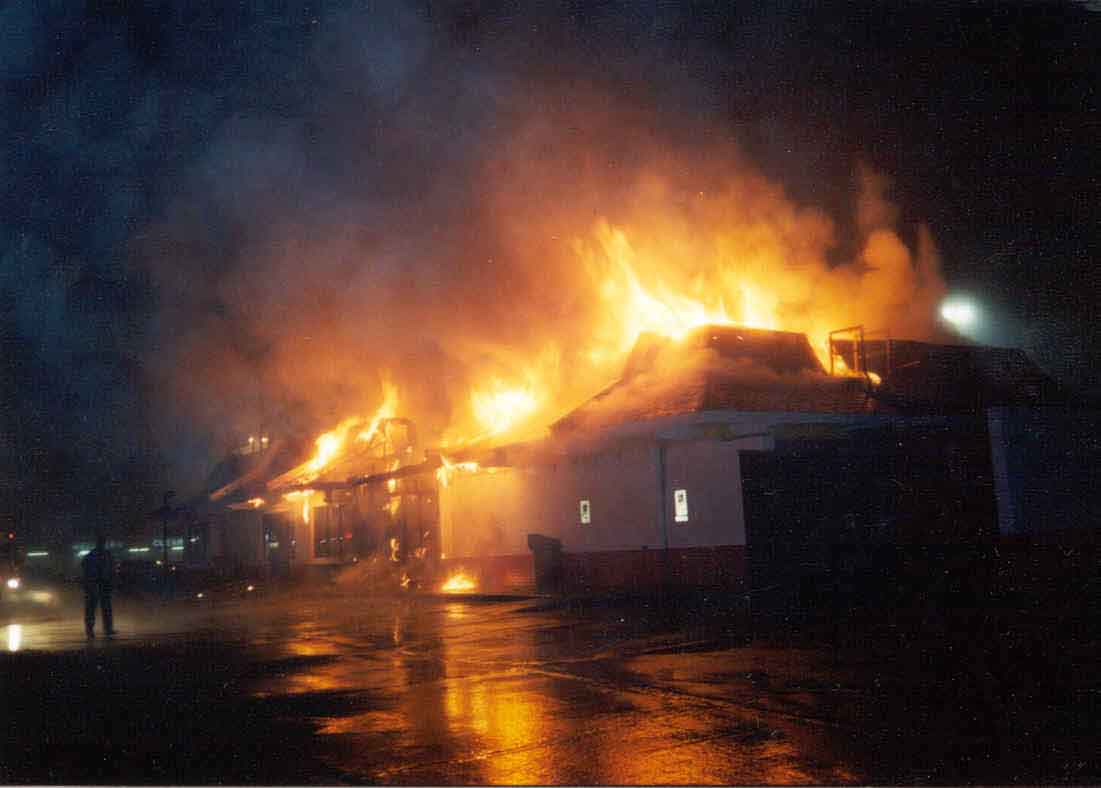 Front page photo: 
    Photograph of the restaurant involved in this incident, fully engulfed in flames.