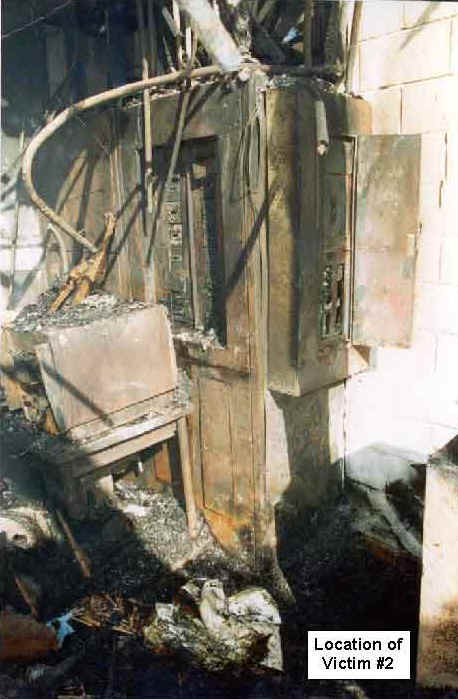Photo 13: Post-fire, interior view of the restaurant, showing the location of Victim #2.