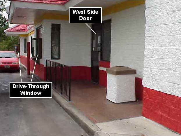 Photo 7: Pre-fire, exterior view of the west side of similar restaurant, showing the drive-through window and west side door.