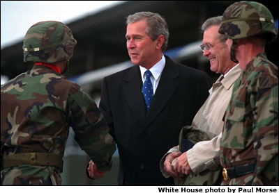 President Bush shakes hands with soldiers. White House photo by Paul Morse.