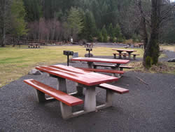 photo of picnic tables at Upper Arm day use showing compacted gravel surface