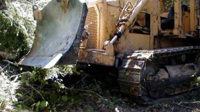 The final resting position of the bulldozer shows the front blade was raised about 1 ft off the ground when parked.