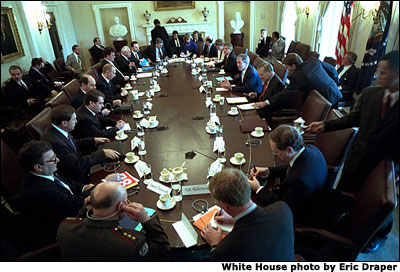 President George W. Bush and his staff meet with visiting Russian President Vladimir Putin in the Cabinet Room Nov. 13. White House photo by Eric Draper.