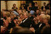 President George W. Bush, Laura Bush and India Prime Minister Dr. Manmohan Singh and Mrs. Gursharan Kaur, applaud the entertainers appearing Monday, July 18, 2005 at the official dinner at the White House. White House photo by Eric Draper