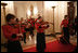Roving musicians enter the State Dining Room, Monday, July 18, 2005 at the White House, at the official dinner in honor of the visit by India's Prime Minister Dr. Manmohan Singh. White House photo by Eric Draper