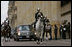 An honor guard escorts a limousine carrying President George W. Bush and Laura Bush Sunday, March 11, 2007, to Casa de Narino, the presidential residence, in Bogota, Colombia. The visit marked the third stop in the couple’s five-country, Latin American visit. White House photo by Paul Morse