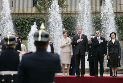 President George W. Bush and Laura Bush stand with Colombia’s President Alvaro Uribe and First Lady Lina Moreno de Uribe, during arrival ceremonies Sunday, March 11, 2007, at the presidential residence in Bogota. White House photo by Eric Draper