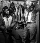 Two Pilots from the 332nd Fighter Group (Tuskegee Airmen) Prepare for a Flight