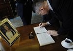 SIGNING THE GUESTBOOK - Click for high resolution Photo