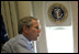 En route to Michigan, President Bush and President Kwasniewski talk on Air Force One. In addition to a private meeting in the President Bush's office, the Polish head of state was treated to a personally-guided tour the famous plane July 18. White House photo by Eric Draper.