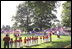 President George W. Bush attends a Tee Ball on the South Lawn game between the Cardinals and the South Berkeley Little League Braves from Inwood, West Virginia. June 23, 2002.