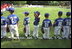 President Bush attends a Tee Ball on the South Lawn game between the Cardinals and the South Berkeley Little League Braves from Inwood, West Virginia, June 23, 2002.