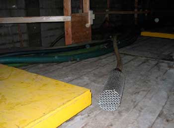 Figure 7. Brine recirculation hose with metal screen.