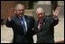 President George W. Bush waves with Chilean President Ricardo Lagos upon his arrival at the APEC CEO Summit in Santiago, Chile, Nov, 20, 2004. 