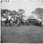 Fredericksburg, Va. Soldiers filling canteens 
 - Five black men on horseback, two standing at head of a horse