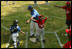 Everyone's on the move as the Memphis Red Sox from Chicago score against the Black Yankees of Newark during "Tee Ball on the South Lawn" Sunday, June 26, 2005.