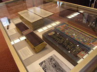 An exhibit case filled with Tibetan artifacts.