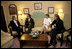 President George W. Bush, Bono, Laura Bush and Bob Geldof, far right, hold a working meeting on Africa at the G8 Summit in Gleneagles, Scotland, Wednesday, July 6, 2005.