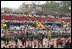 People sitting in the pattern of the Costa Rican flag fill the stands as President-elect Oscar Arias walks in a procession as part of his inaugural ceremony at the Estadio Nacional in San Jose, Costa Rica, Monday, May 8, 2006.