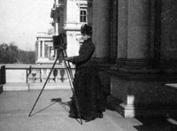 a woman photographer in period dress