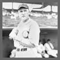 Rogers Hornsby standing with a bat on his shoulder.