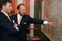 Prince Johannes Waldburg-Wolfegg points out a detail on the Waldseemüller map to Christoff Meran of the Embassy of Austria.