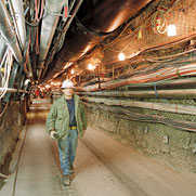 Man walking in the miles of tunnels under the test site