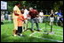 President George W. Bush hosts Tee Ball on the South Lawn with The Oriole Advocates Challengers of Marley Area Little League of Glen Burnie, Maryland and The Ridley Police Challengers of Leedom Little League, Ridley Park, Pennsylvania, July 27, 2003.