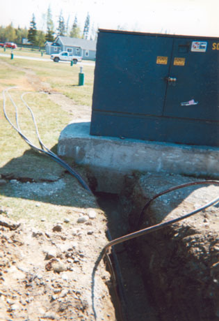 Figure 2. View of trench and cables leading under foundation