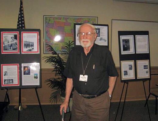 Lou Wolfe with panels from a NMAJMH traveling display